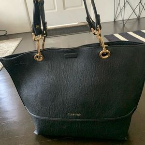 New Calvin Klein leather handbag, barely used. Gold trim. Bag included.